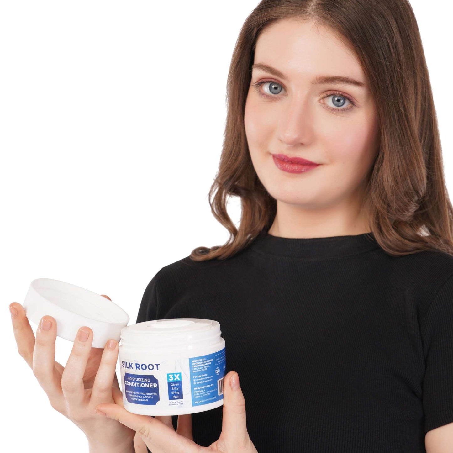 Silk Root Hair Conditioner 200 gm displayed in woman's hand.