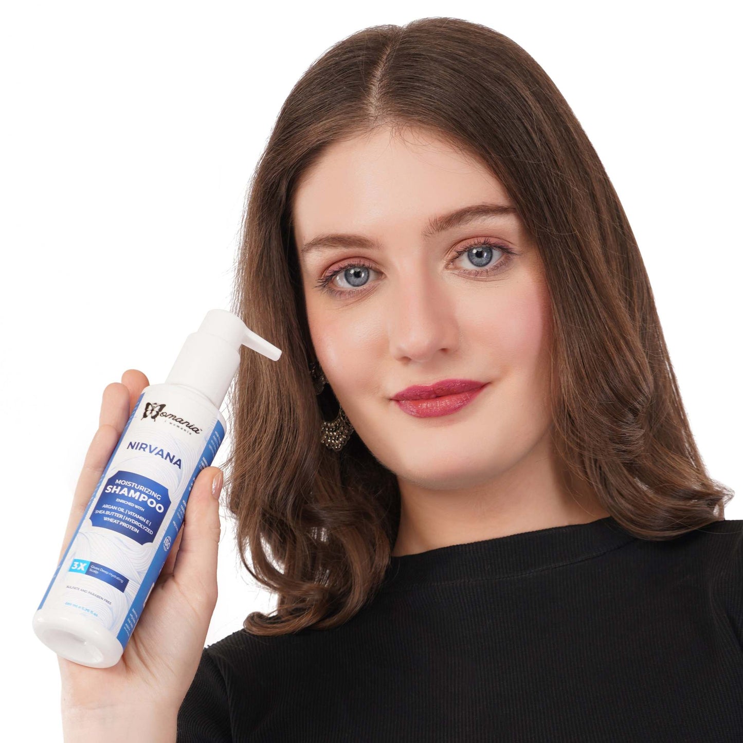 Hair Moisturizing Shampoo in 200 ml bottle held by a person.
