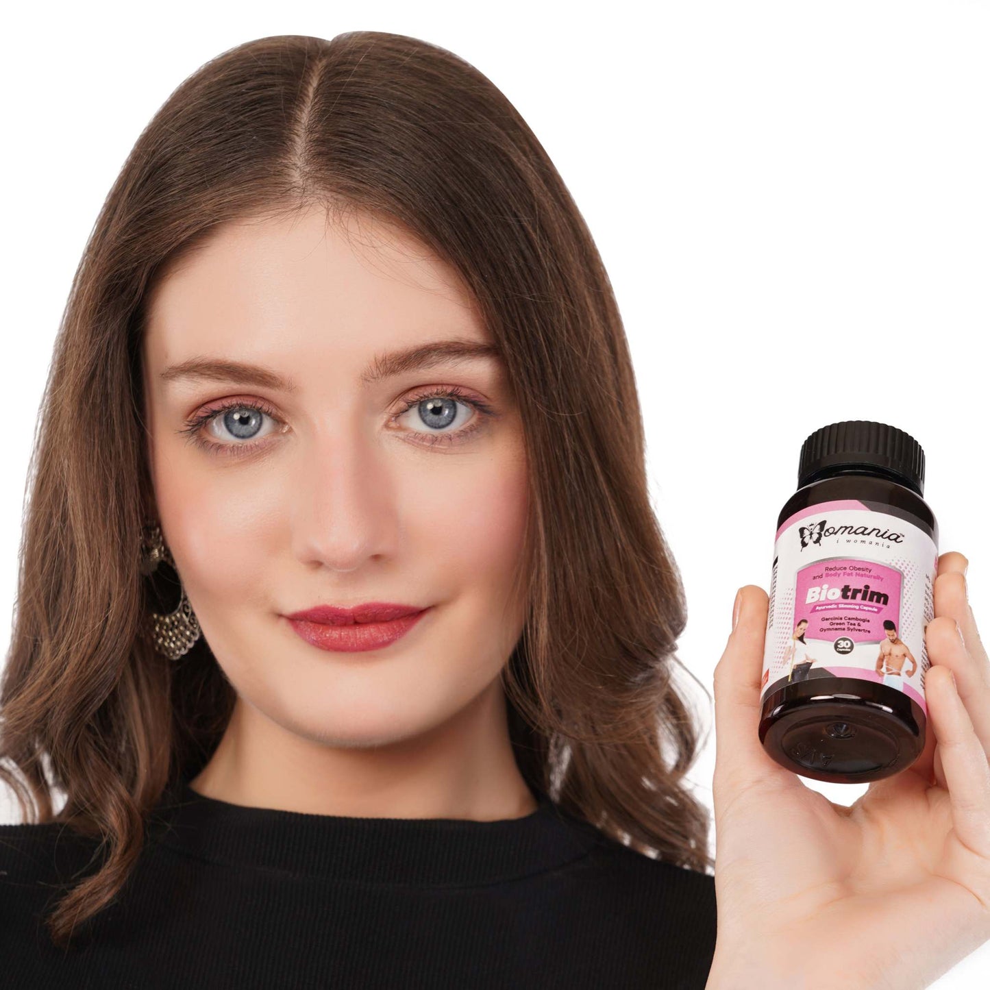 Woman holding Bio Trim health capsules, promoting Ayurvedic and herbal weight reduction.