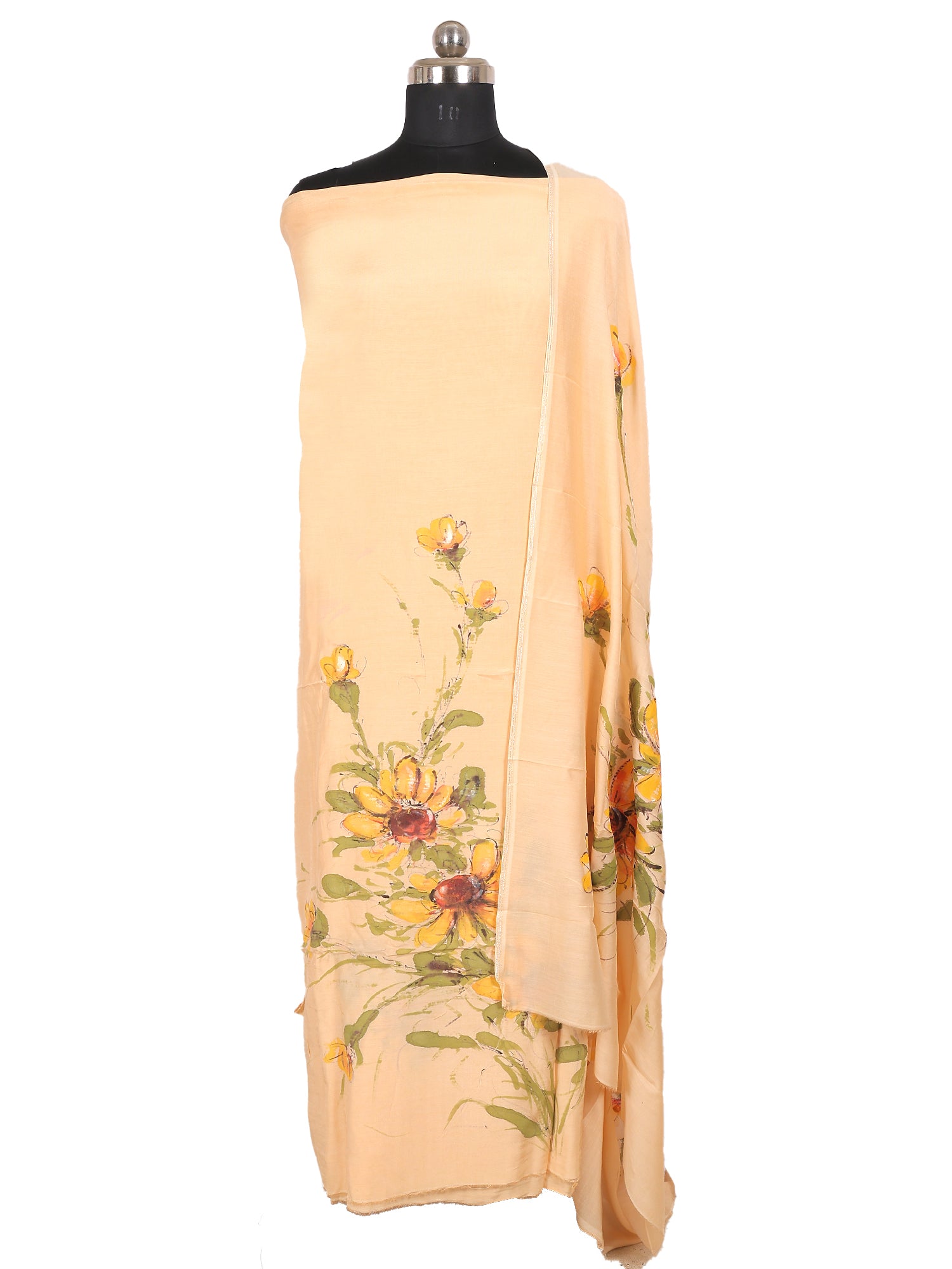 Hand painted muslin suit draped on a mannequin, showcasing vibrant floral designs in light peach and beige colors.